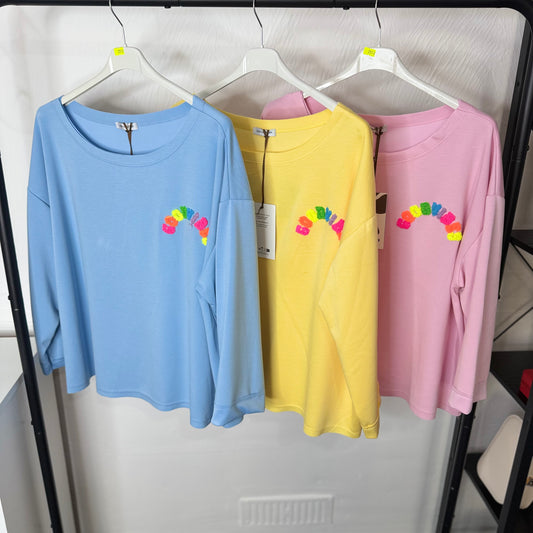 Astrid Multicoloured Good Vibes Oversized Top with Rainbow Embroidery in Blue Yellow and Pink