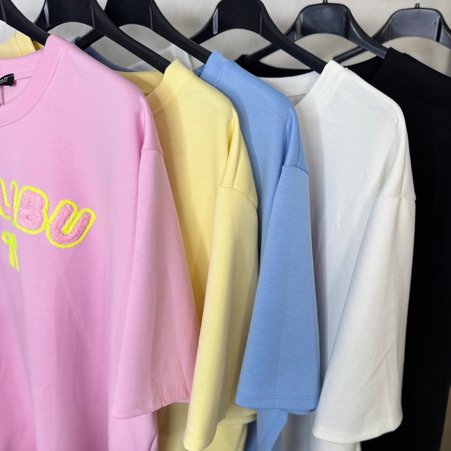 Lily - Oversized Malibu Flocking Stitch T-Shirt in Soft Pink with Bold Yellow Lettering and Bow Detail