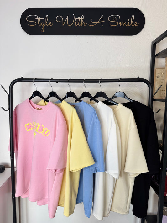 Lily - Oversized Malibu Flocking Stitch T-Shirt in Soft Pink with Bold Yellow Lettering and Bow Detail