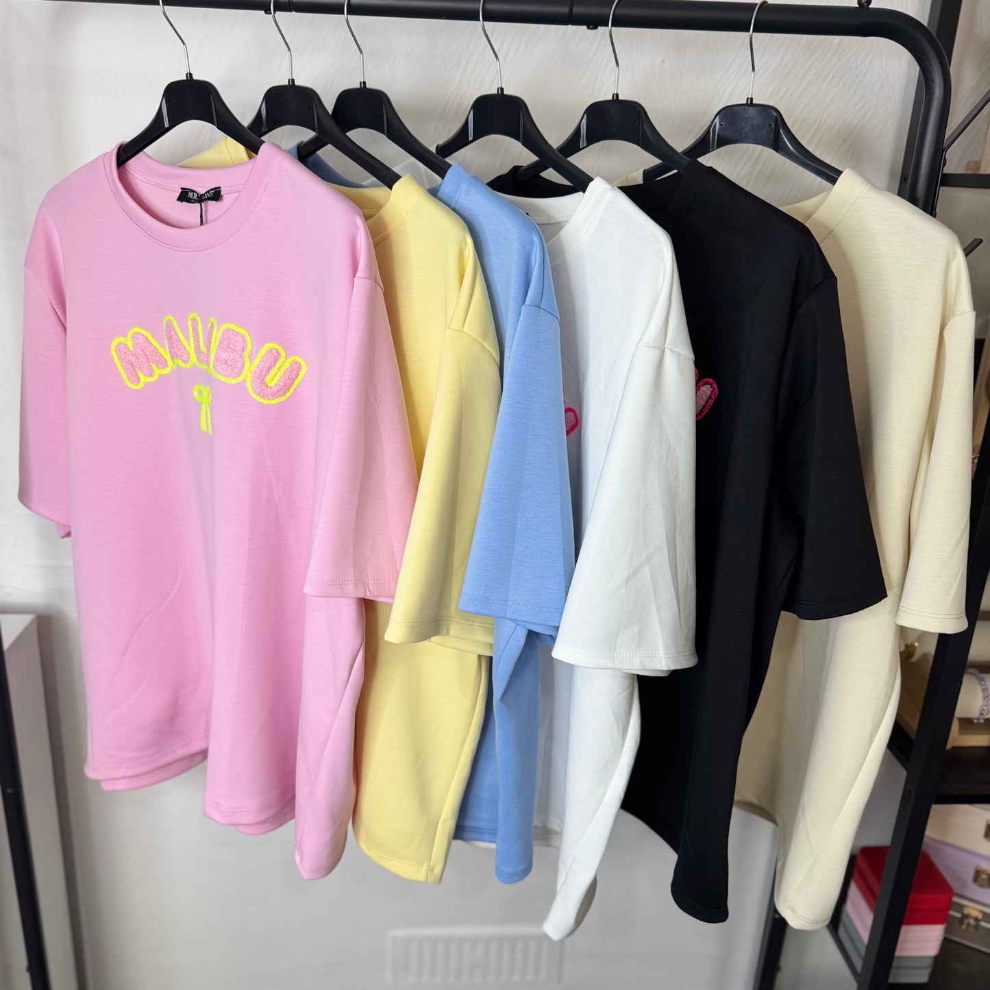 Lily - Oversized Malibu Flocking Stitch T-Shirt in Soft Pink with Bold Yellow Lettering and Bow Detail